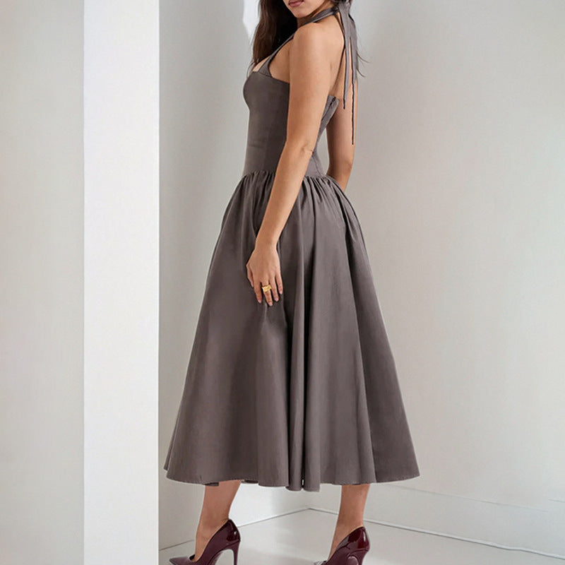 Halter neck backless maxi dress with a flared skirt